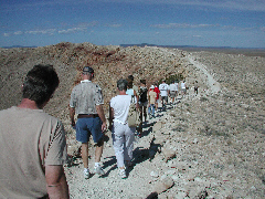 people alonge rim of crater