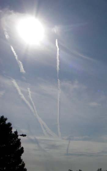 The Sun, high altitude contrails, and shadows