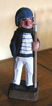 carving of a harpooner
